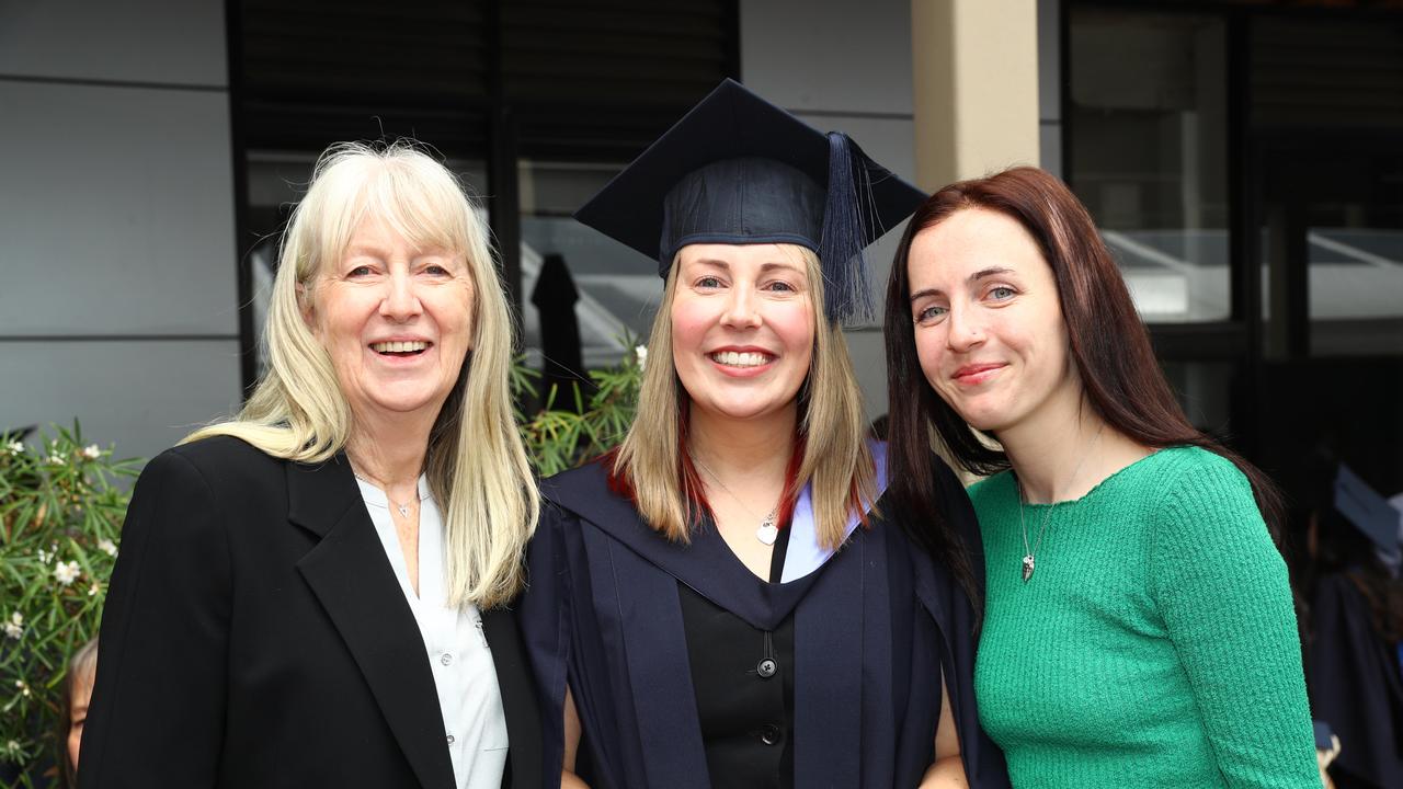 Deakin University graduate Emily Merchant with mum Jane and niece Bridget Merchant. Picture: Alison Wynd