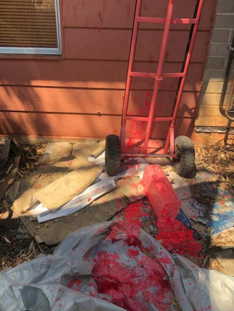 Paint is seen splashed on the side of the family home in Alice Springs. supplied