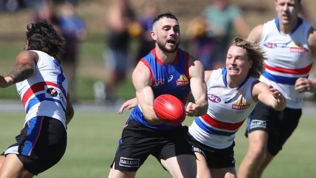 Toby McLean wins the footy at Western Bulldogs training. Picture: David Crosling