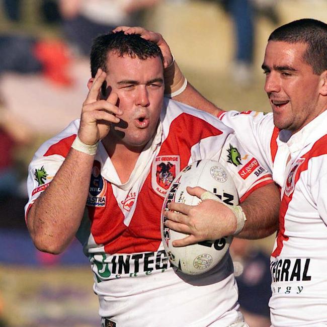 Mark Riddell (L) celebrating a try with teammate Aaron Gorrell.