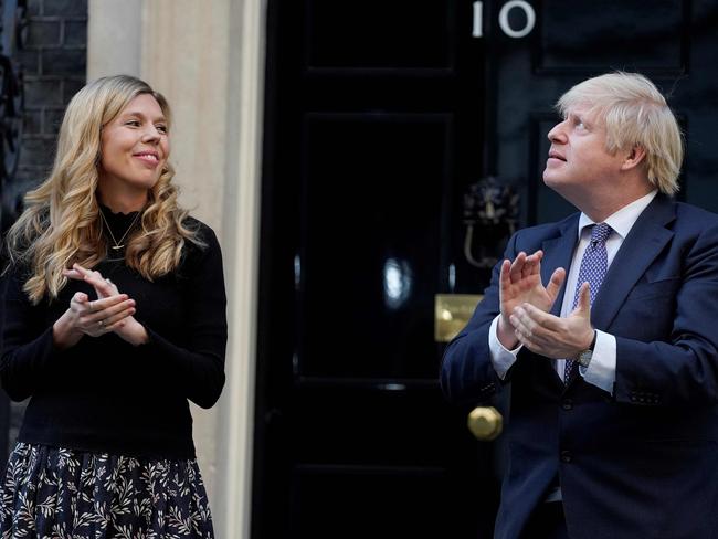 Boris Johnson (R) and his fiancee Carrie Symonds participate in a national "clap for carers" to show thanks for the work of Britain's National Health Service workers. Picture: 10 Downing Street / AFP