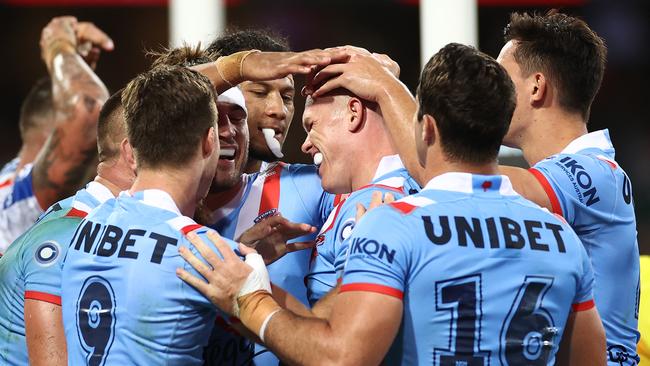 Lindsay Collins of the Roosters celebrates a try (Photo by Cameron Spencer/Getty Images)