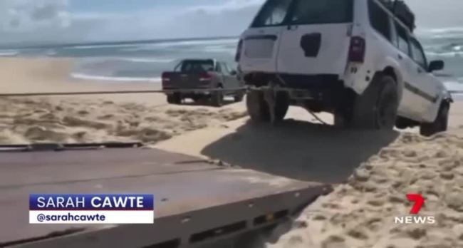 WATCH VIDEO 2: 4WD pulled from the ocean at Teewah Beach. Credit: 7 News