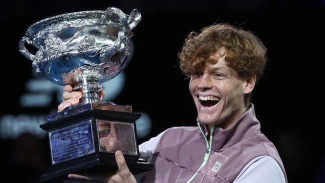 Italy's Jannik Sinner celebrates with the Norman Brookes Challenge Cup trophy after defeating Russia's Daniil Medvedev in the men's singles final of the Australian Open. Picture: David Gray/AFP