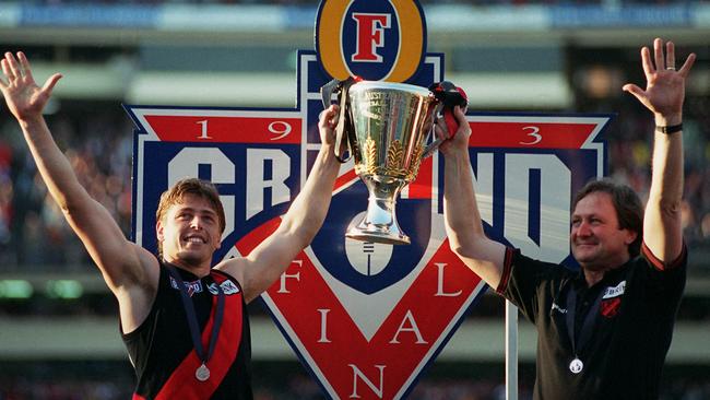 Thompson and Dons coach Kevin Sheedy hold up the 1993 Premiership Cup.