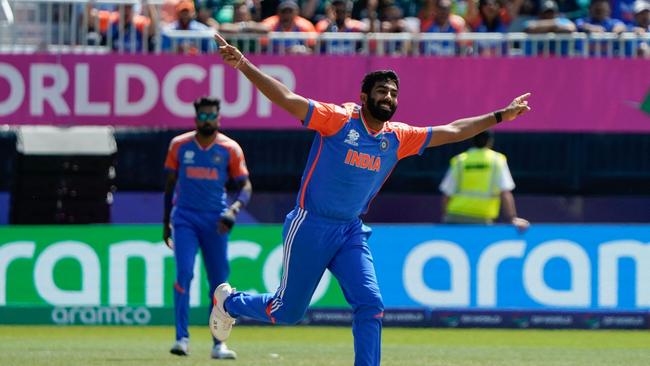 India's Jasprit Bumrah celebrates after taking a wicket. Photo by TIMOTHY A. CLARY / AFP.