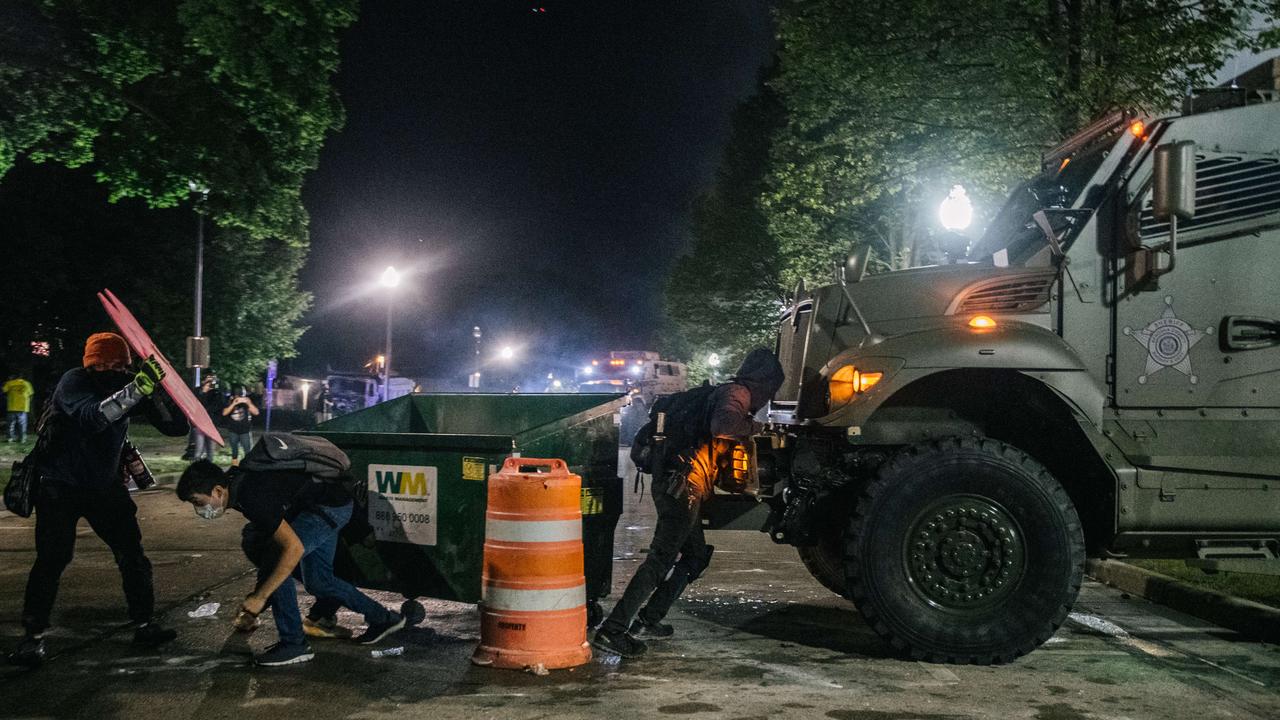 Demonstrators block an armoured police vehicle during protests over the shooting of Jacob Blake. Picture: Brandon Bell/Getty Images/AFP