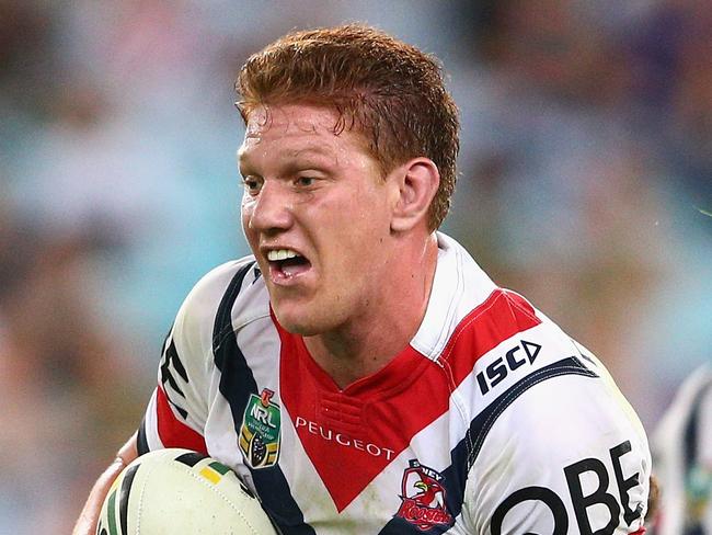 SYDNEY, AUSTRALIA - APRIL 08: Dylan Napa of the Roosters is tackled during the round six NRL match between the South Sydney Rabbitohs and the Sydney Roosters at ANZ Stadium on April 8, 2016 in Sydney, Australia. (Photo by Cameron Spencer/Getty Images)