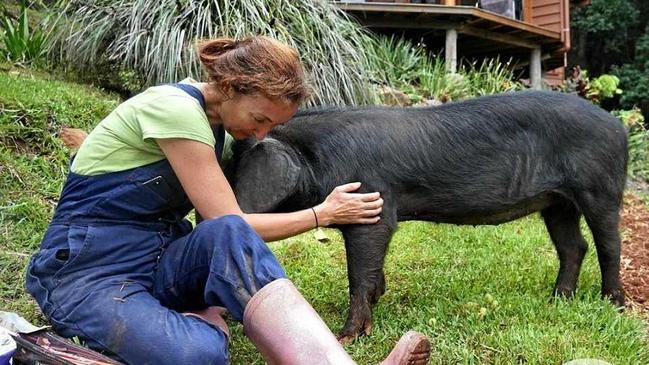 Sugarshine Farm founder Kelly Nelder and pig in care, Precious.