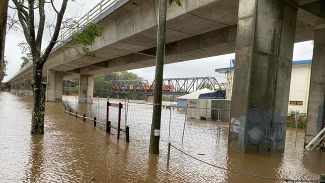 Water up over park lands under the bridge at Urunga.