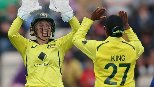 Alyssa Healy and Alana King of Australia celebrate after taking the wicket of Tammy Beaumont (Photo by Steve Bardens/Getty Images)