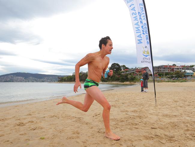 Joseph Dalco, from Kingston High School, finishing off his swim leg in the grade 8 individual boys section.