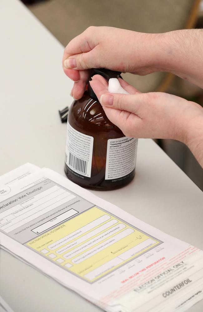 Hand sanitiser used by an election official during pre-polling at City Hall, Brisbane. Picture: Liam Kidston