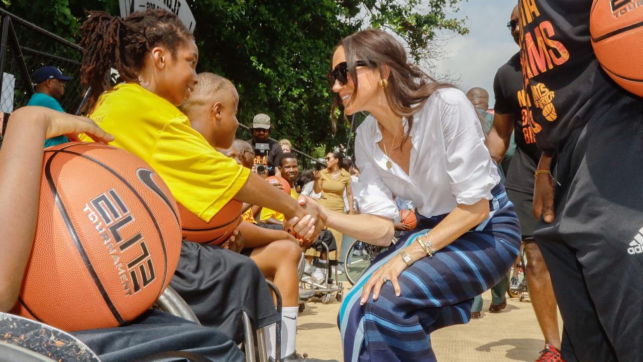 The Duchess meets children at a basketball match in Lagos. Picture: Andrew Esiebo
