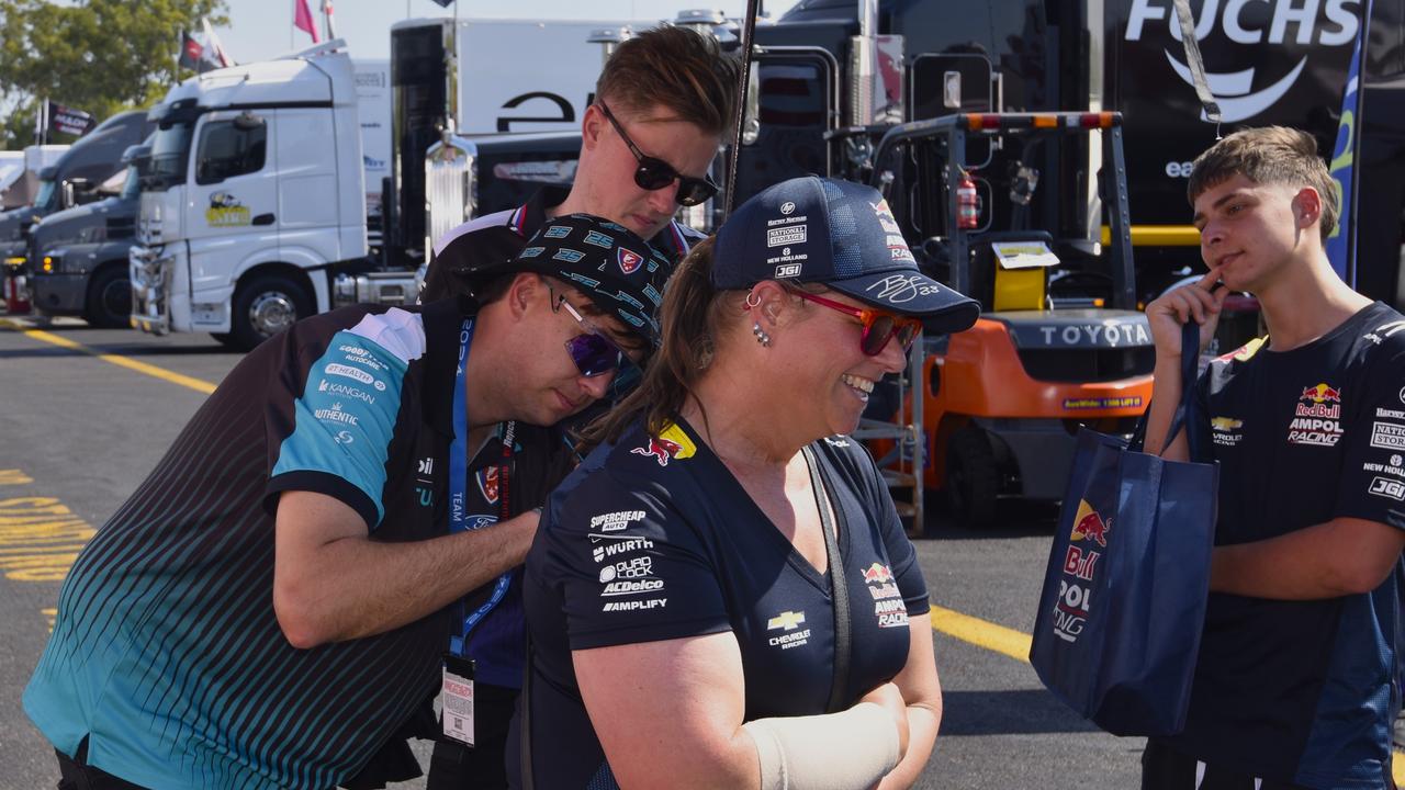 Supercars driver Chaz Mostert signing a fans t-shirt in the pits at the 2024 Darwin Triple Crown. Picture: Darcy Jennings.