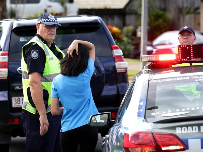 An unknown distraught woman arrives at the scene. Two women are dead and a man is in custody after an incident at Wiltshire Drive in Gordonvale. Picture: Marc McCormack