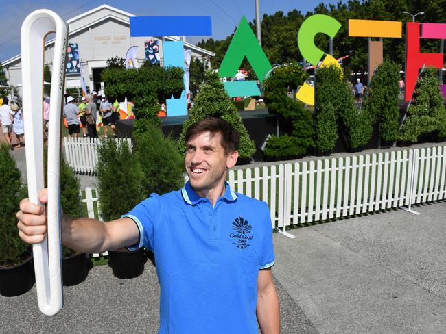 Triple-Olympian Eddie Ockenden, pictured with the Queen's Baton in Hobart earlier this year, will play hockey at his third Commonwealth Games.