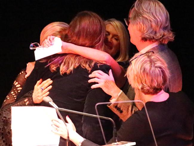 Simmone Logue speaks with Harry's kids at the Harry M Miller memorial. Picture: John Grainger