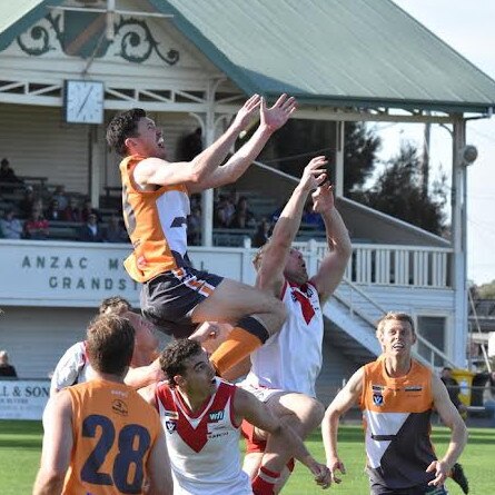 Southern Mallee Giants coach Kieran Delahunty soars over the pack in the Wimmera league second semi-final against Ararat. Picture: Georgia Hallam