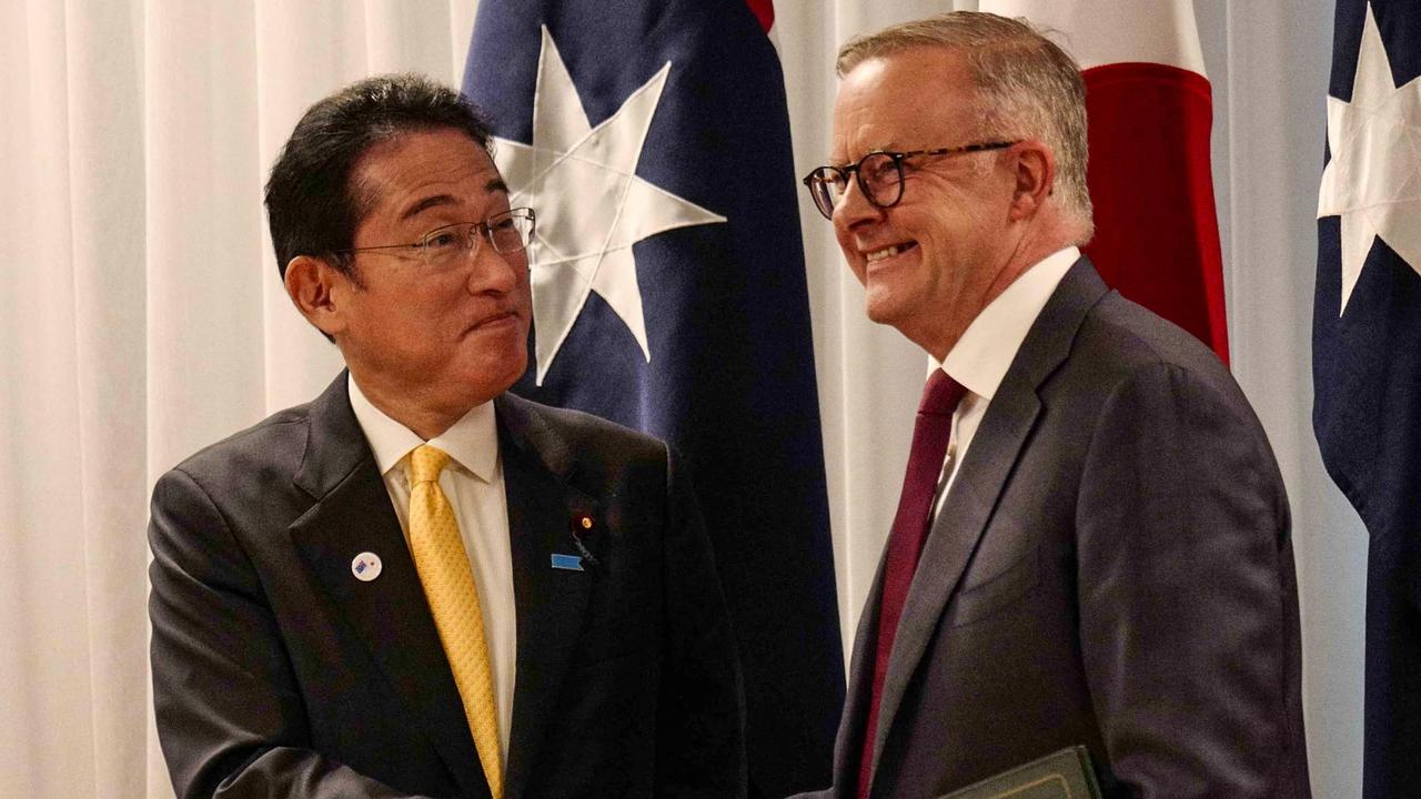 Australia's Prime Minister Anthony Albanese shakes hands with Japanese Prime Minister Fumio Kishida during a 2022 meeting. Picture: Tony McDonough / AFP