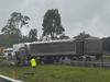Truck jackknifes across major highway causing wet weather chaos