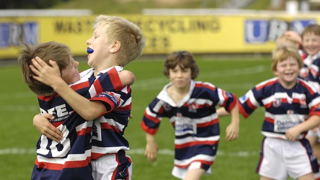 Another Grand Final day. Luke Trbojevic and Sam Verrills, wearing number 18, playing for Mona Vale celebrate the under 8's win at Brookvale Oval.