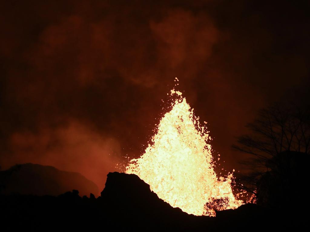 Lava erupts from a Kilauea volcano fissure on Hawaii's Big Island on May 22, 2018 in Kapoho, Hawaii. Officials are concerned that 'laze', a dangerous product produced when hot lava hits cool ocean water, will affect residents. Laze, a word combination of lava and haze, contains hydrochloric acid steam along with volcanic glass particles. Mario Tama/Getty Images/AFP