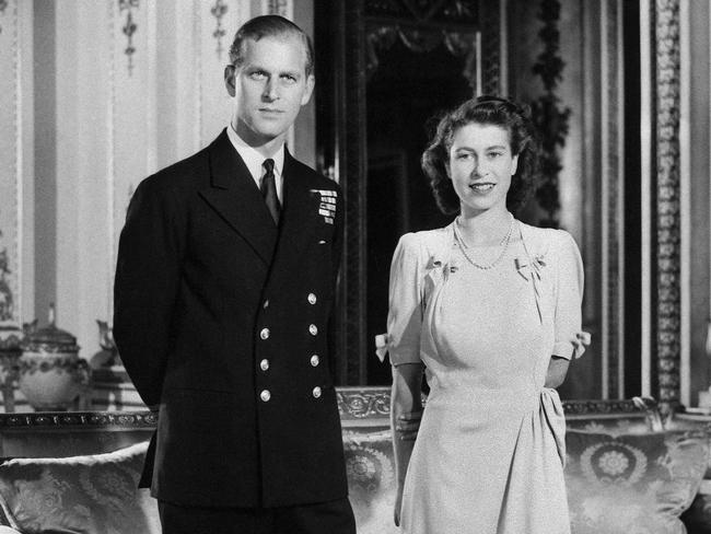 Princess Elizabeth (future Queen Elizabeth II) and her fiance Philip Mountbatten pose in Buckingham Palace, London, on the day their engagement was officially announced. Picture: AFP Photo