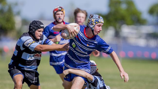 Day One of King of the Country rugby tournament at James Overell Park, Southport. Maroochydore Swans U14s' ( big stripes - blue) in action against USQ Saints U14s' (darker blue small stripes). USQ Saints U14's Xavier Austin . Picture: Jerad Williams