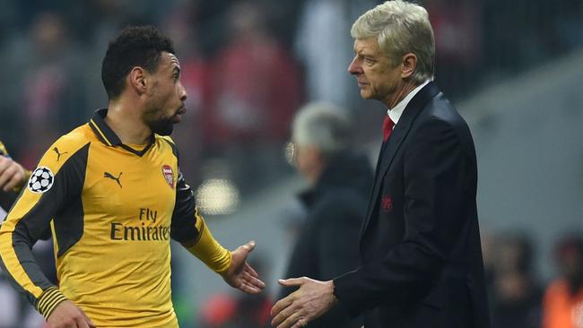 Arsenal's French midfielder Francis Coquelin (L) and Arsenal's French headcoach Arsene Wenger.