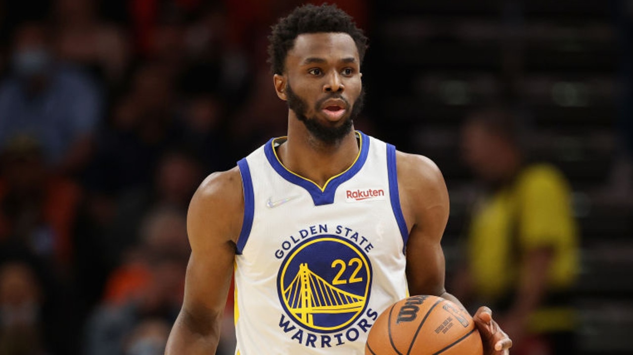 PHOENIX, ARIZONA - NOVEMBER 30: Andrew Wiggins #22 of the Golden State Warriors handles the ball during the first half of the NBA game at Footprint Center on November 30, 2021 in Phoenix, Arizona. NOTE TO USER: User expressly acknowledges and agrees that, by downloading and or using this photograph, User is consenting to the terms and conditions of the Getty Images License Agreement. (Photo by Christian Petersen/Getty Images)