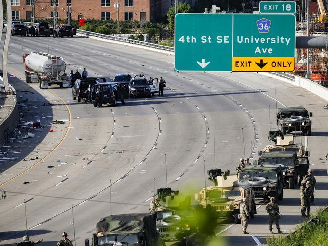 A semi-truck involved in an incident with protesters on Highway 35W is surrounded by authorities. Picture: AP