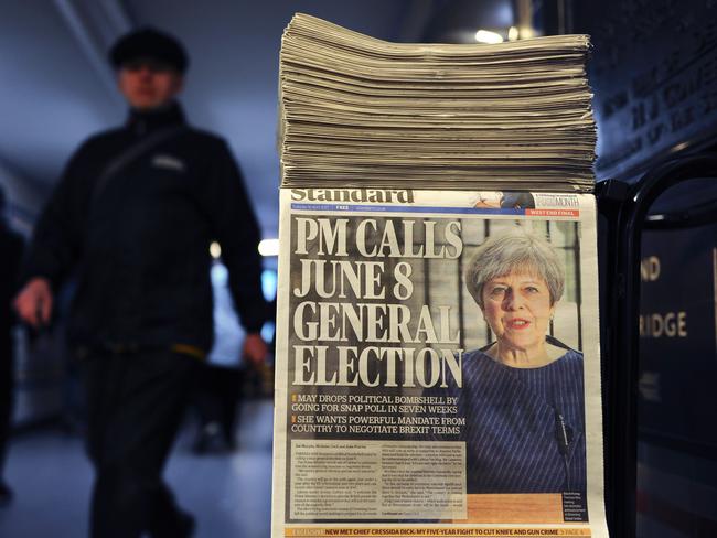 A newspaper stand shows a copy of today's Evening Standard, with the front page story relating to British Prime Minister Theresa May's call for a snap general election on June 8, in central London on April 18, 2017.  British Prime Minister Theresa May called Tuesday for a snap election on June 8, in a shock move as she seeks to bolster her position before tough talks on leaving the EU. May is apparently aiming to cash in on her 20-point lead over the main opposition Labour party to increase her majority and give her a stronger hand in the Brexit battles with Brussels ahead.  / AFP PHOTO / DANIEL SORABJI