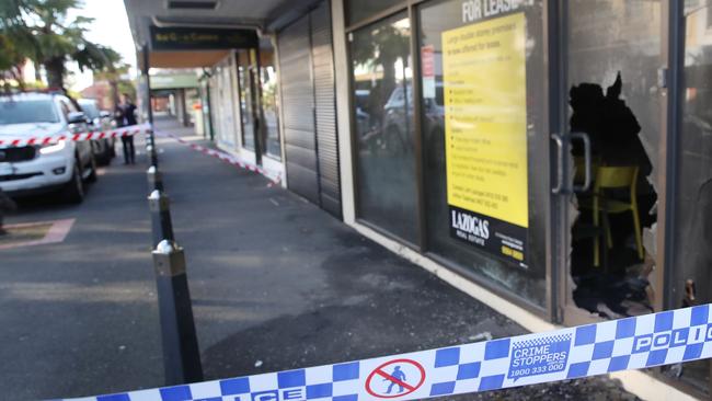 A tobacco shop and accountants office were damaged in a suspected fire bombing. Picture: David Crosling