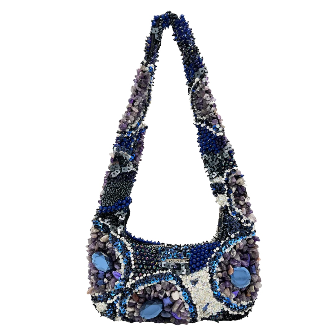 <p><strong>Germanier Am&eacute;thyste bag</strong></p><p class="button-common"><a title="SHOP NOW FOR $1340" href="https://kevingermanier.com/collections/shop-all/products/up-cycled-beads-handbag-copy-1" target="_blank" data-cta="SHOP NOW FOR $1340" data-editable="true">SHOP NOW FOR $1340</a></p>