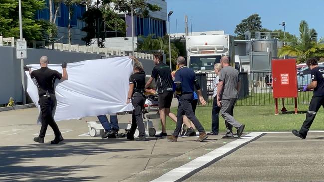 Rescuers touch down at Mackay Base Hospital after winching a man found clinging to an overturned boat 150km off the coast of Mackay. Picture: Janessa Ekert