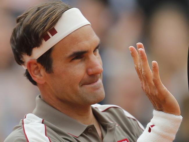 Switzerland's Roger Federer celebrates winning against Italy's Lorenzo Sonego during their first round match of the French Open tennis tournament at the Roland Garros stadium in Paris, Sunday, May 26, 2019. (AP Photo/Michel Euler )