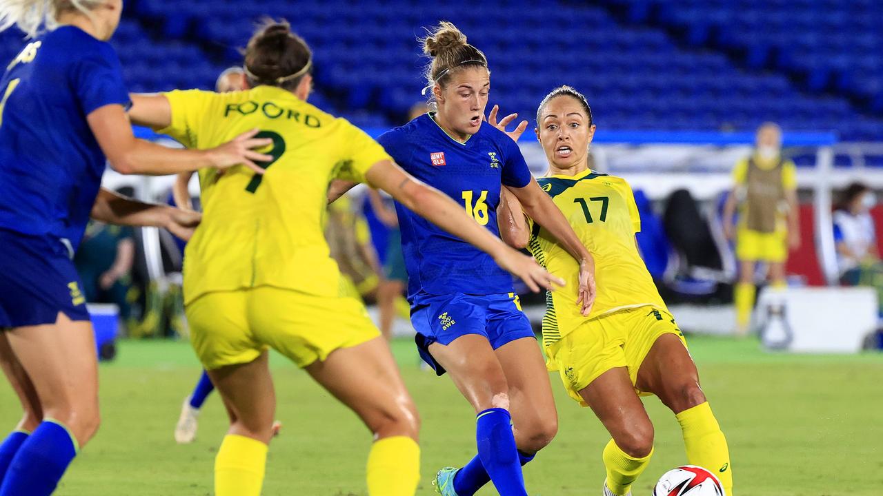 Kyah Simon (right) battles for possession against Sweden. Picture:s Adam Head