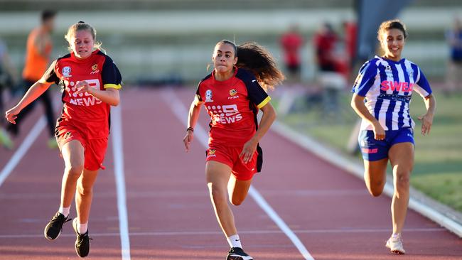 Emilia Murray, middle, representing NTC, records the third fastest time in the preliminary heats of the IGA Dash for Cash at Santos Stadium. Picture: Mark Brake