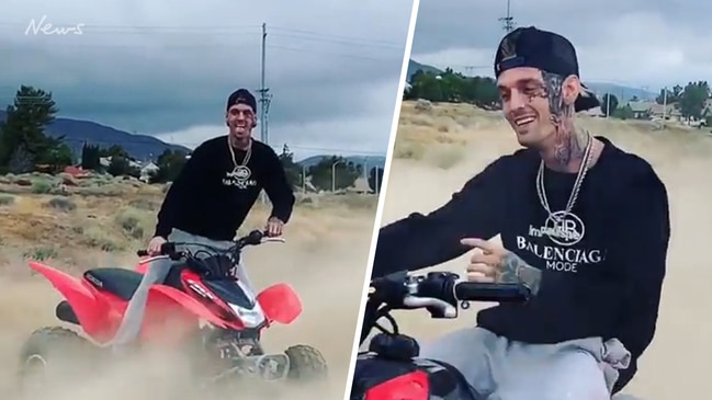 Aaron Carter shows off new face tattoo while quad biking