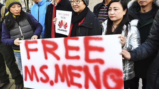 People protest outside a Vancouver courthouse before the bail hearing of Meng Wanzhou, Huawei’s chief financial officer. Picture: AP