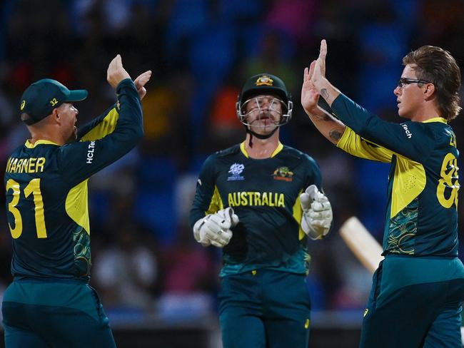 Adam Zampa (R) celebrates with teammate David Warner (L) at this year’s T20 World Cup. Picture: Getty