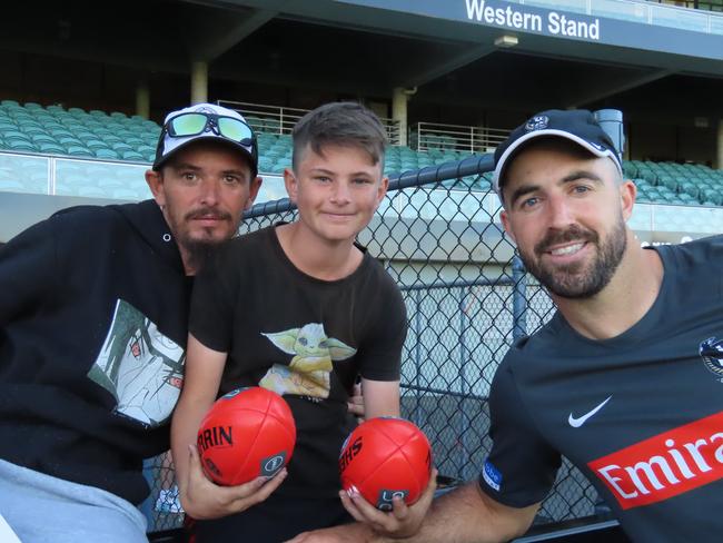 Josh and Lucas Baylis with Collingwood player Steele Sidebottom. Picture: Jon Tuxworth