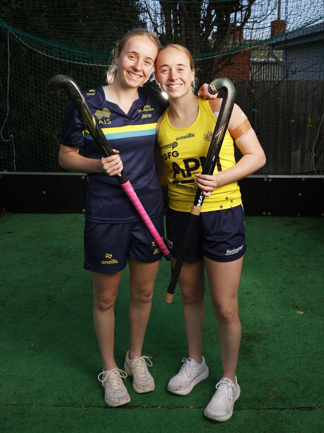 Maddi Brooks on right with twin sister Taylor who is in the under 21 Australian hockey team. Maddi Brooks at home in Hobart. Tasmanian Maddi Brooks 19 has been named in the Paris 2024 Olympic women's hockey team as a travelling reserve. Picture: Nikki Davis-Jones