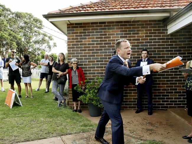 Auctioneer David Gray in action during the aucton. Action from the Auction at  24 Dudley Street Pagewood. The property sold for 1.57 Million dollars. Picture: John Appleyard