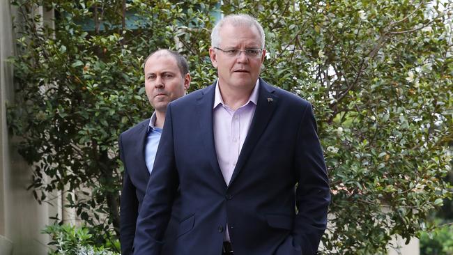 Prime Minister Scott Morrison and Treasurer Josh Freydenberg front the media at Kirribilli House yesterday. Picture: David Swift.