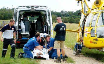 Paramedics work on a woman after a horse accident at Myocum yesterday. . Picture: Westpac Helicopter