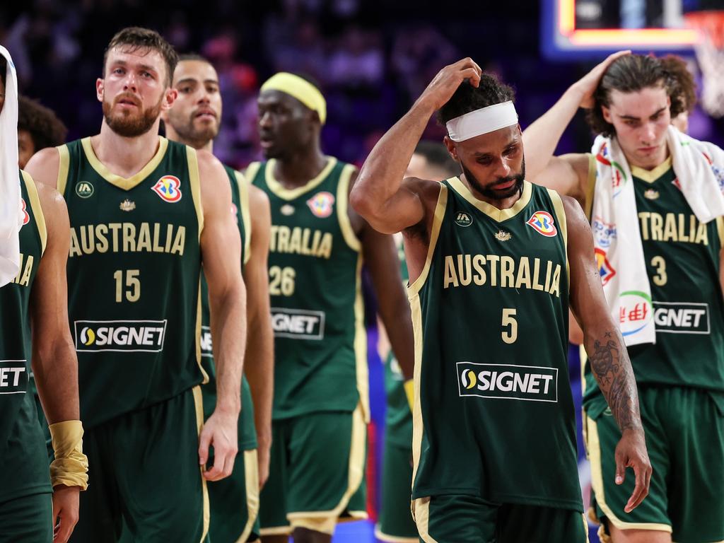 Australian players look dejected. Picture: Takashi Aoyama/Getty Images