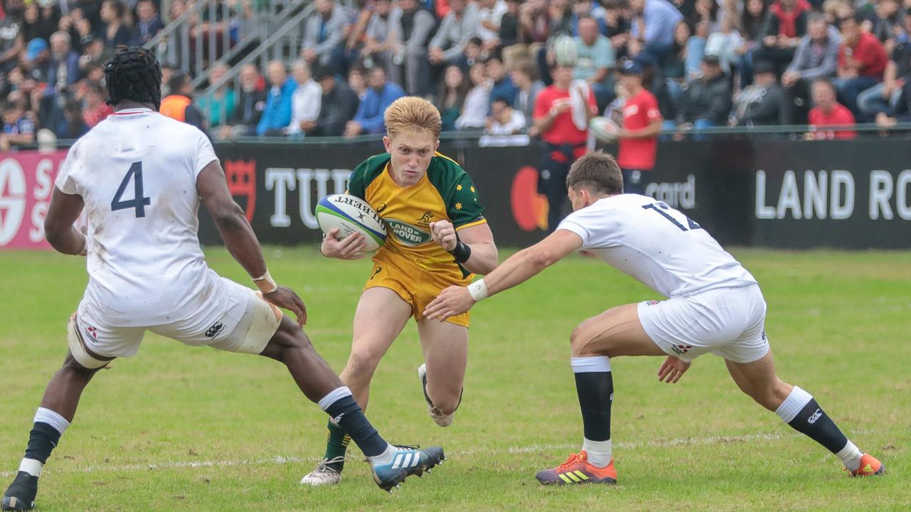 Isaac Lucas attempts to break the English line during their loss at the under-20s World Cup.