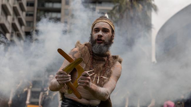 Indigenous performers perform the welcome to country during a smoke ceremony prior to the state funeral service for Uncle Jack Charles Picture: Asanka Ratnayake/Getty Images)